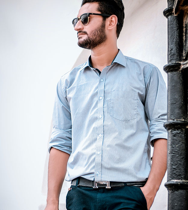 Man wearing pale blue shirt